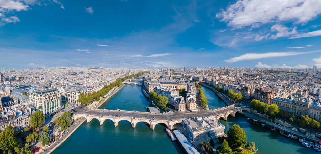 paris aerial panorama with river seine, pont neuf bridge, ile de la cite and notre dame church, france. holidays vacation destination. panoramic view above historical parisian buildings and landmarks.